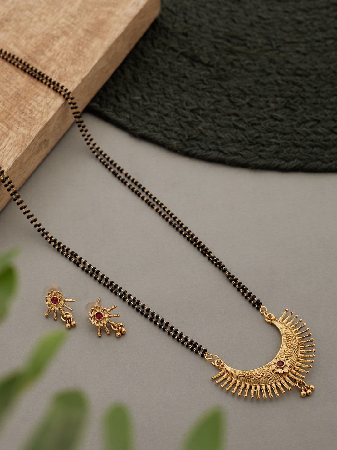 ATIBELLE Gold-Plated Maroon Stone StuddedBlack Beaded Floral Mangalsutra With Earrings - Image 1