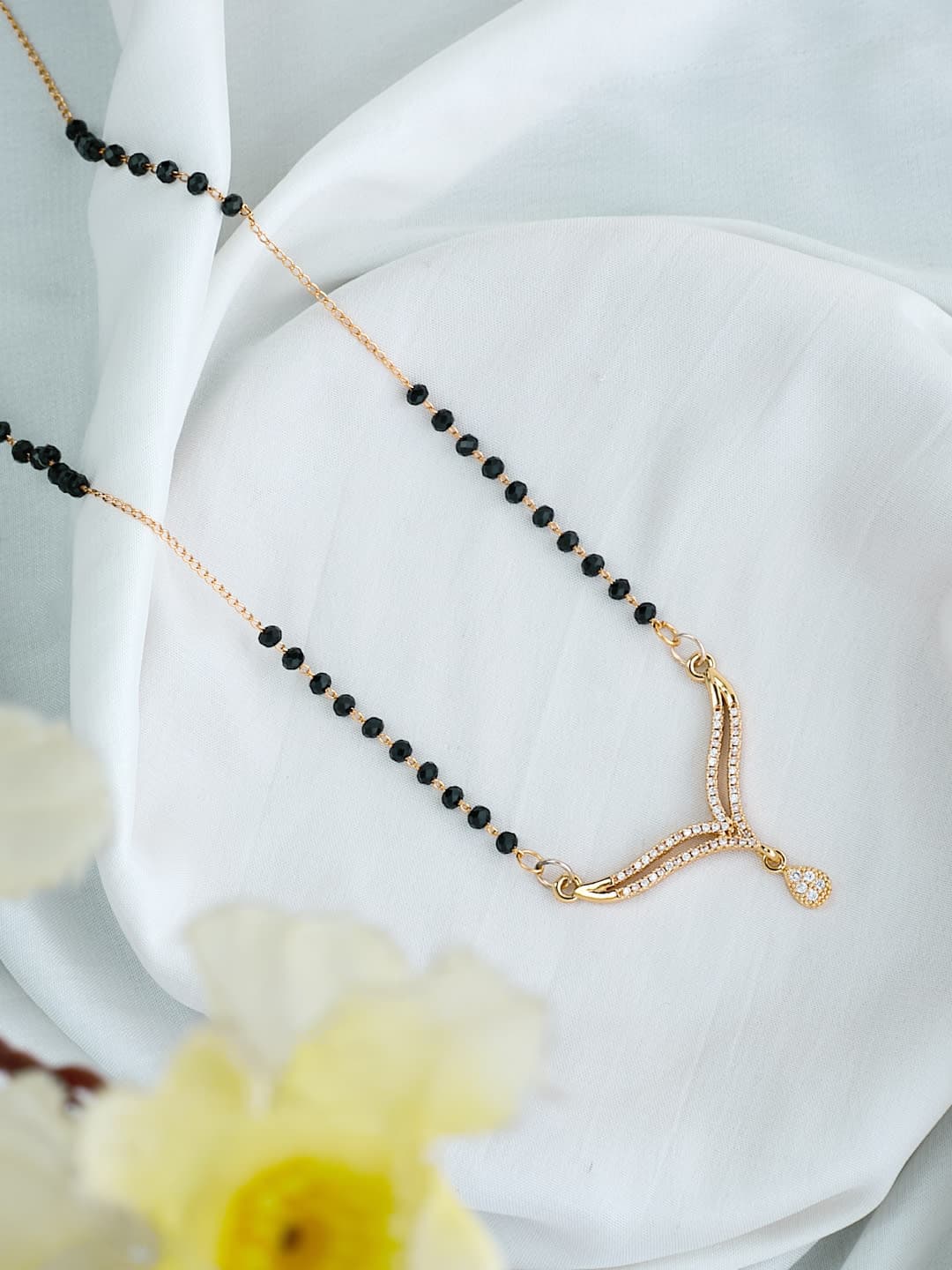 ATIBELLE Gold-Plated Cubic Zirconia Stone Studded & Beaded V-Shaped Mangalsutra - Image 1