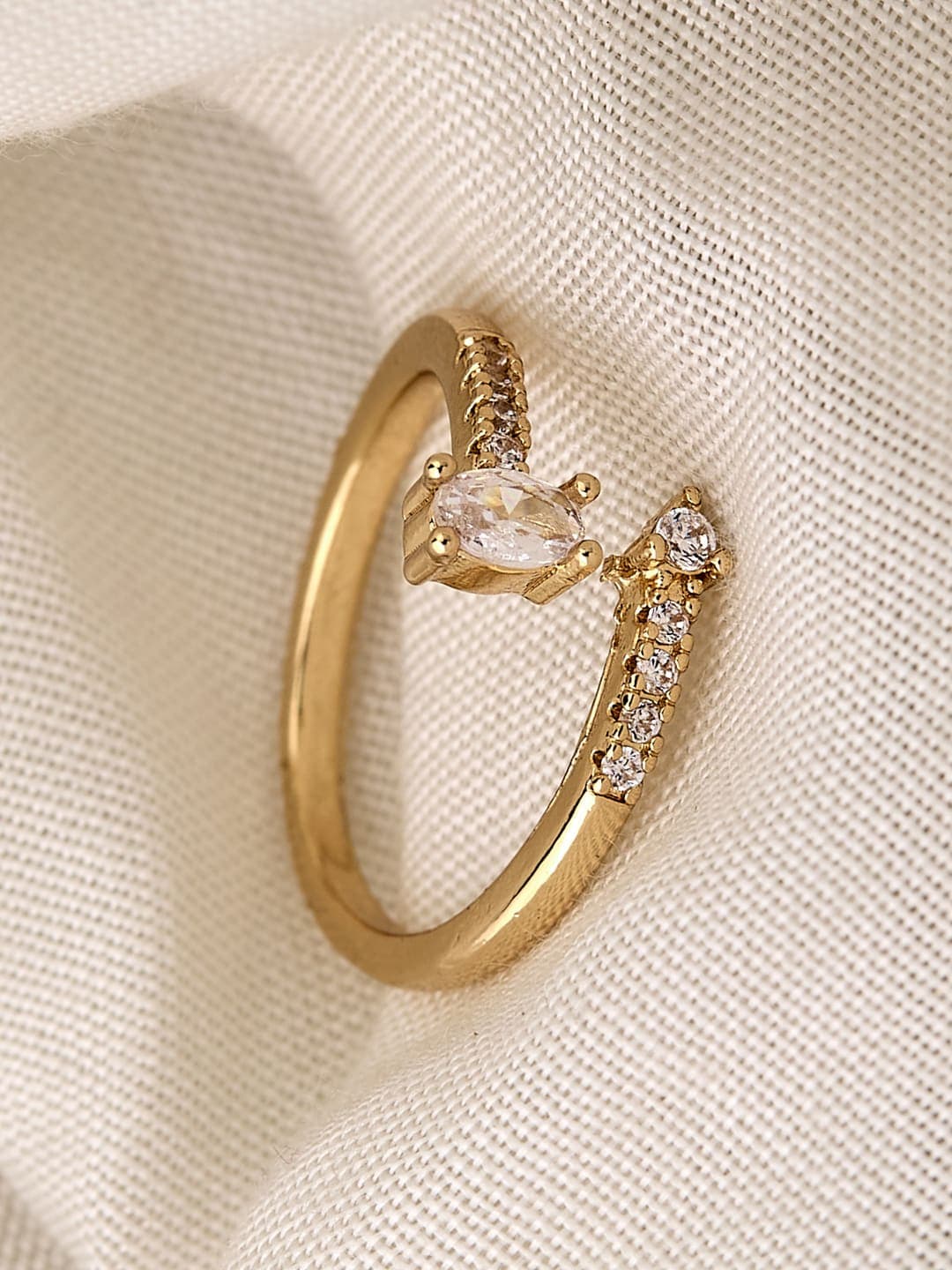 ATIBELLE Gold Plated Cubic Zirconia Stone Studded Oval-Shaped Dazzling Finger Ring - Image 1